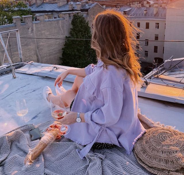 woman holding a glass of wine